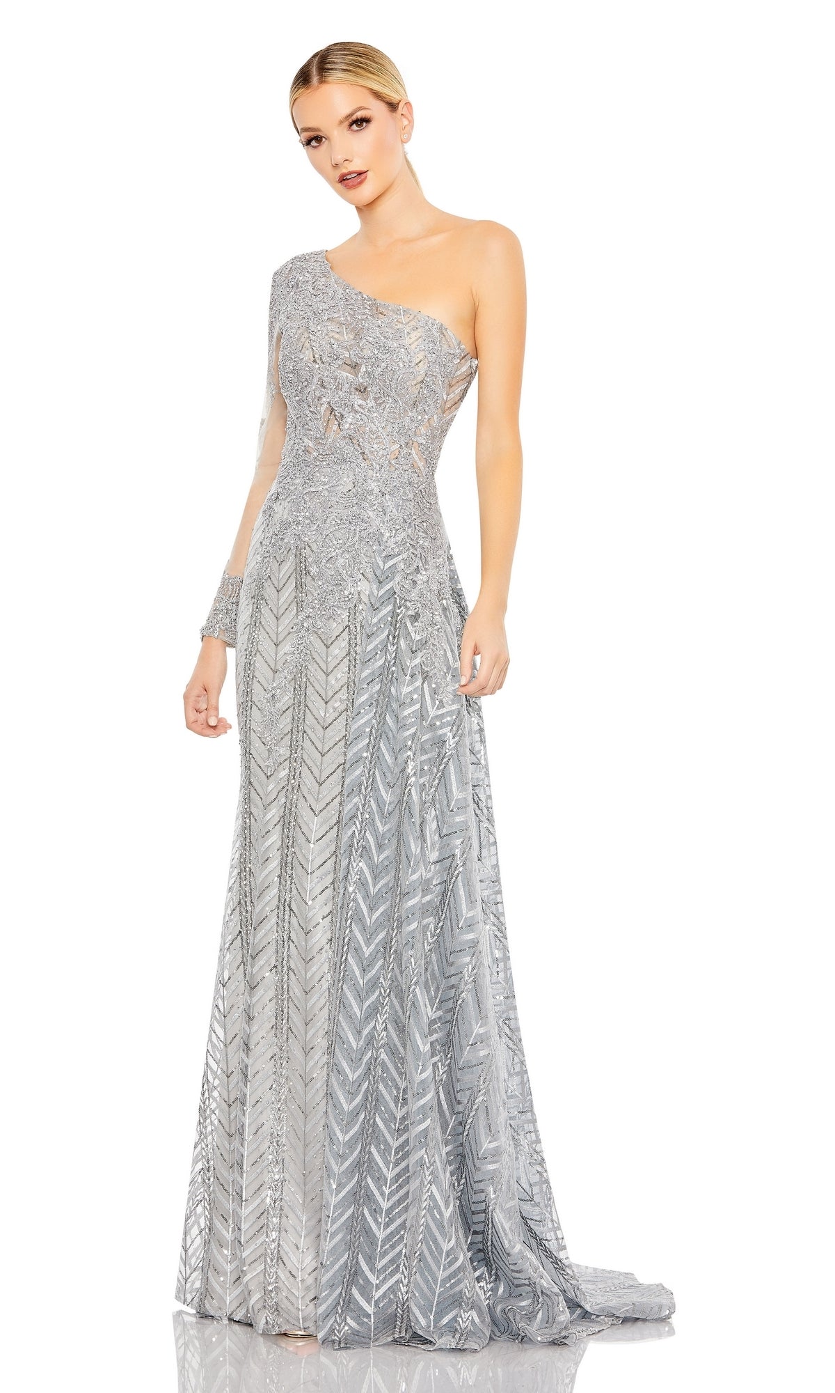 Woman wearing the Mac Duggal 20401 One-Sleeve Long Formal Dress in silver, featuring a one-shoulder design, intricate geometric patterns, and a fitted waist for an elegant look.