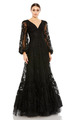 A woman wears the Mac Duggal 20430 Long Sleeve Long Formal Dress, featuring sheer puffed sleeves, floral embroidery, and a V-neckline, standing against a plain white background.