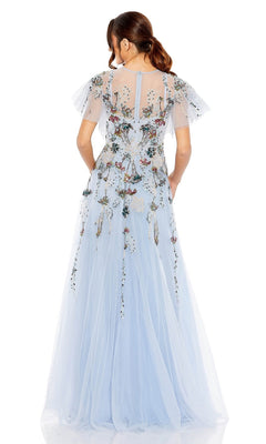 A woman stands facing away from the camera in the Mac Duggal Long Formal Dress 20436, a light blue, floor-length A-line gown featuring embroidery, flutter sleeves, and floral details.