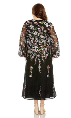 A woman faces away, wearing the Plus-Size Semi-Formal Dress 20474 by Mac Duggal—a black sheer long-sleeve midi dress with colorful floral embroidery—paired with nude heels.