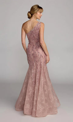 A woman stands with her back to the camera, wearing the Mac Duggal 20482—a fitted, one-shoulder blush pink mermaid gown featuring sequins and embellished lace—set against a plain background.