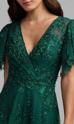 A person wearing the Short Sleeve Mauve Formal Dress: Mac Duggal 20486, featuring a v-neckline, intricate beadwork, and floral lace details on sheer mauve fabric.