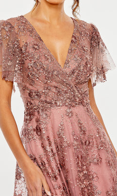 Pink embellished dress with a V-neckline on a white background