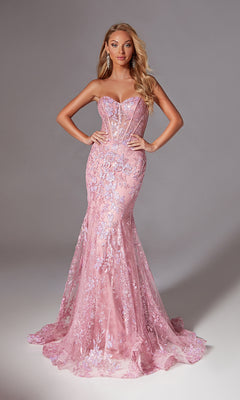 A woman stands with hands on hips, wearing the Aerie Couture 204 Sparkly Long Mermaid Prom Dress, featuring floral lace details, a sheer corset bodice, and a fitted floor-length silhouette against a plain gray background.