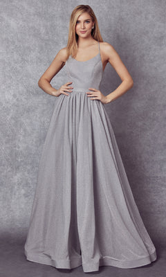 A woman poses in the Juliet 204 Long Prom Dress, a sleeveless, floor-length gown with a shimmering full skirt, set against a gray textured backdrop.