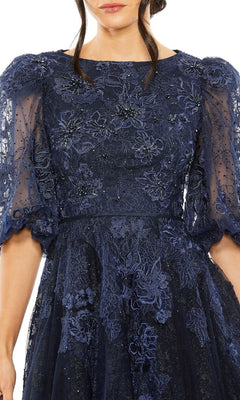 Woman wearing the Long Formal Dress 20506 by Mac Duggal in midnight blue, an embroidered lace A-line style with sheer, puffed sleeves and floral details, shown from shoulders to mid-thigh.