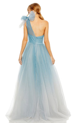 A woman is shown from the back wearing the Long Formal Dress 20552 by Mac Duggal, a light blue one-shoulder A-line ball gown with tulle and a large bow detail on the shoulder.