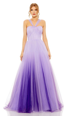 A woman stands against a white background wearing the Mac Duggal Long Formal Dress 20553, a floor-length gown with a purple ombre design, ruched bodice, and halter neckline.