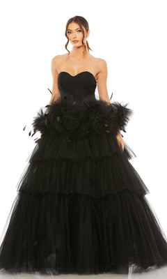 A woman poses in the Long Formal Dress 20572 by Mac Duggal, a strapless ball gown with a sweetheart bodice, tiered tulle layers, and floral waist details, set against a plain white background.