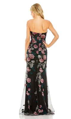 A woman with blonde hair is shown from the back wearing the Long Formal Dress 20581 by Mac Duggal, a strapless gown with pink and green floral embroidery.