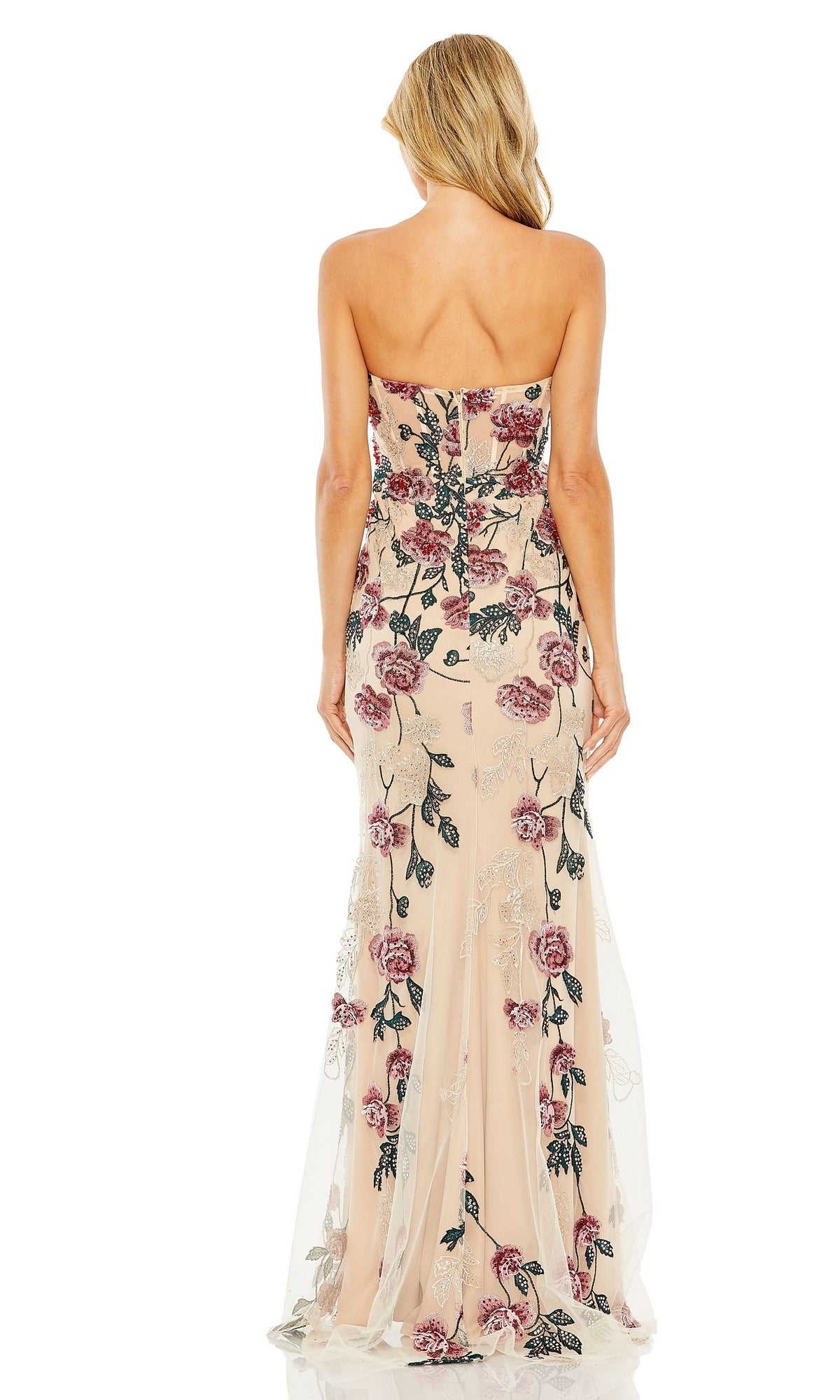 A woman models the Long Formal Dress 20581 by Mac Duggal, a strapless floor-length nude gown with pink floral embroidery and a fitted sweetheart neckline, shown from the back against a white background.