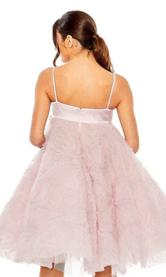 A woman with brown hair in a ponytail models the Short Homecoming Dress 20583 by Mac Duggal—a rose pink, textured dress with thin straps—shown from the back against a white background.