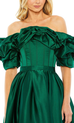 A woman models the Mac Duggal 20706 Off-Shoulder Wedding Guest Dress in emerald green, featuring voluminous ruffled sleeves and a fitted bodice—ideal for any semi-formal event.