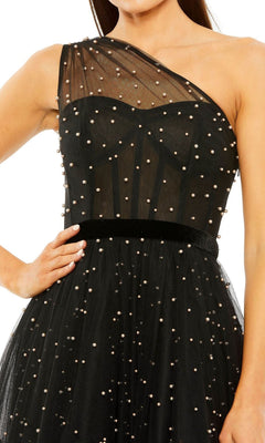 A woman poses confidently with one hand on her hip in the Mac Duggal 20745 Black Midi Wedding Guest Dress, featuring a one-shoulder design, pearl embellishments, and a black waistband.