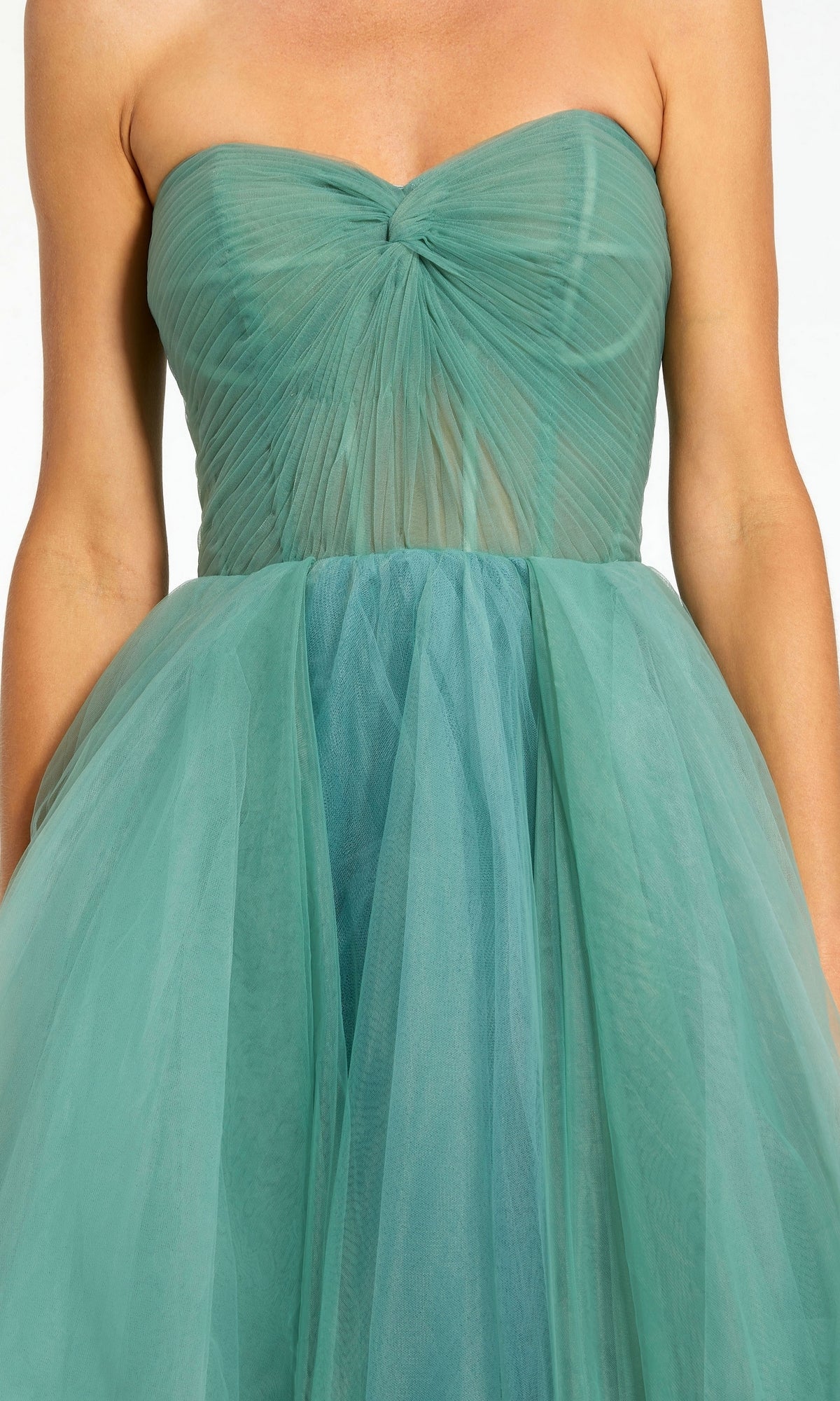 A person wearing the Long Formal Dress 20772 by Mac Duggal, a strapless teal tulle ball gown with a ruched bodice and full, flowing skirt.
