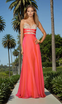 Woman in a strapless pink evening gown with a high neckline, standing in a palm tree-lined garden.