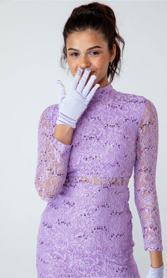 A woman models the affordable Eureka 2095 Long Sleeve Sequin-Lace Formal Dress in lavender, paired with matching gloves, standing against a plain light background with one gloved hand near her mouth.