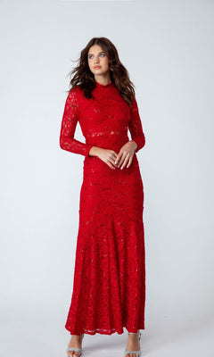 A woman poses against a plain white background wearing the Eureka 2095, a long-sleeve, floor-length red sequin-lace formal dress.