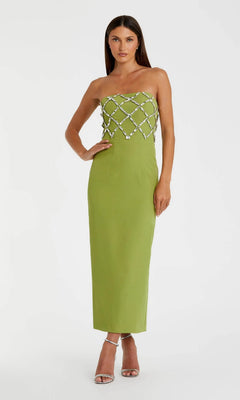 A woman models the Long Formal Dress: Mac Duggal 21064 in apple green, which features a strapless design with crystal lattice bodice embellishments, paired with silver high-heeled sandals.