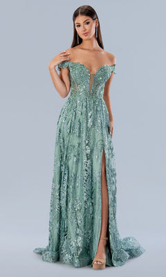 A woman stands against a plain gray background wearing the Stella Couture 21064 long prom dress in sage, featuring an off-the-shoulder neckline, sparkly sequins, and a thigh-high slit.