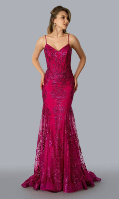 A woman stands against a plain gray background wearing the Corset-Bodice Sparkly Long Mermaid Prom Dress 21066, a fitted magenta sequin gown with lace detailing, thin straps, sheer overlay, and an embellished corset silhouette.