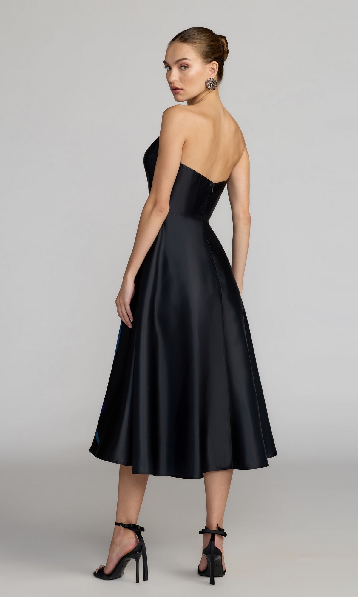 Woman wearing the Midi Floral Semi-Formal Dress: Mac Duggal 21075, shown standing and looking over her shoulder against a plain background.
