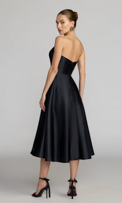Woman wearing the Midi Floral Semi-Formal Dress: Mac Duggal 21075, shown standing and looking over her shoulder against a plain background.