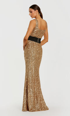 Woman showing the back of a long gold sequin evening gown with a black belt standing in front of a white background