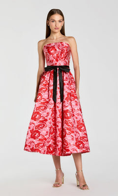 Wearing the Mac Duggal 21252 Tea-Length Party Dress in Red Multi, a woman stands in heels against a plain background.