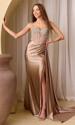 Woman in a long, elegant bronze dress with a high slit standing against a neutral background.