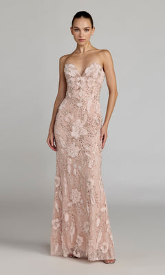 A woman in the Mac Duggal 21283 long formal dress, a strapless floor-length gown in porcelain with floral embroidery and delicate floral appliques, stands against a plain light gray background.
