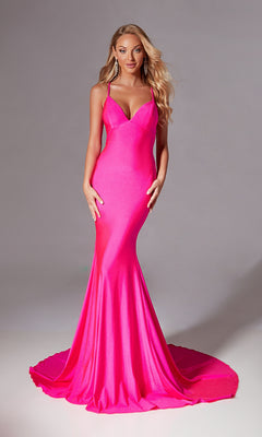 A woman models the Aerie Couture 212 Strappy Long Mermaid Prom Dress in bright pink, featuring spaghetti straps and a floor-length fitted silhouette, standing before a plain gray background.