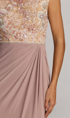 A close-up of a person wearing the Mac Duggal 21324 Long Formal Dress in mauve, showcasing a beautifully embroidered bodice adorned with floral embroidery, sequins, and bead details, complemented by draped fabric on the column jersey skirt.