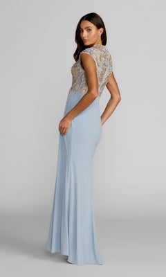 A woman wearing the Long Formal Dress: Mac Duggal 21330—a light blue, floor-length gown featuring intricate beaded detailing and an embroidered bodice with cap sleeves—stands against a plain gray background.