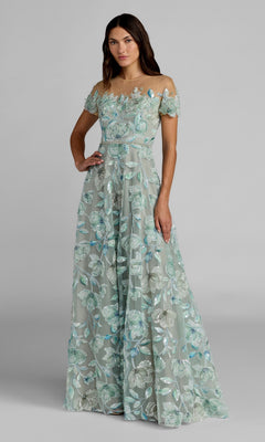 A woman model wears the Mac Duggal 21339 long formal dress in Sage Multi, featuring off-the-shoulder styling and floor-length beaded floral embroidery, posed against a plain gray background.