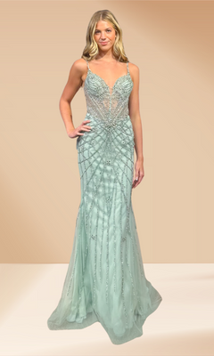 Woman wearing a sage green beaded evening gown against a beige background