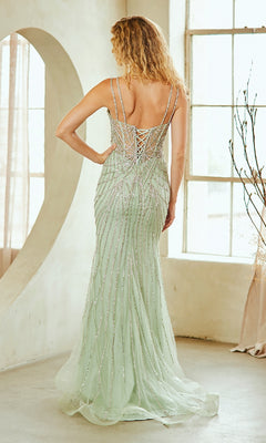 Woman modeling the back of a long, light green dress with a lace-up back in a bright room.