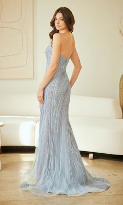 A woman in the Amelia Couture 2137 long prom dress with intricate beadwork stands in a modern, light-colored room, looking over her shoulder.
