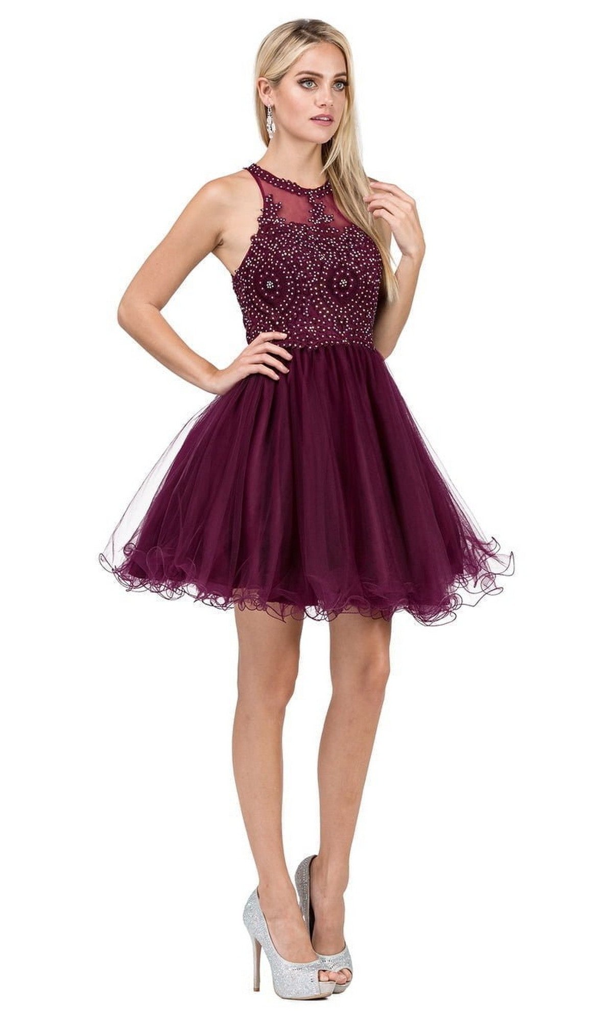 A woman wearing the Beaded Embroidered Lace Short Babydoll Party Dress, featuring a sleeveless design, intricately embroidered bodice, and a tulle skirt, paired with silver high heels, stands against a white background.