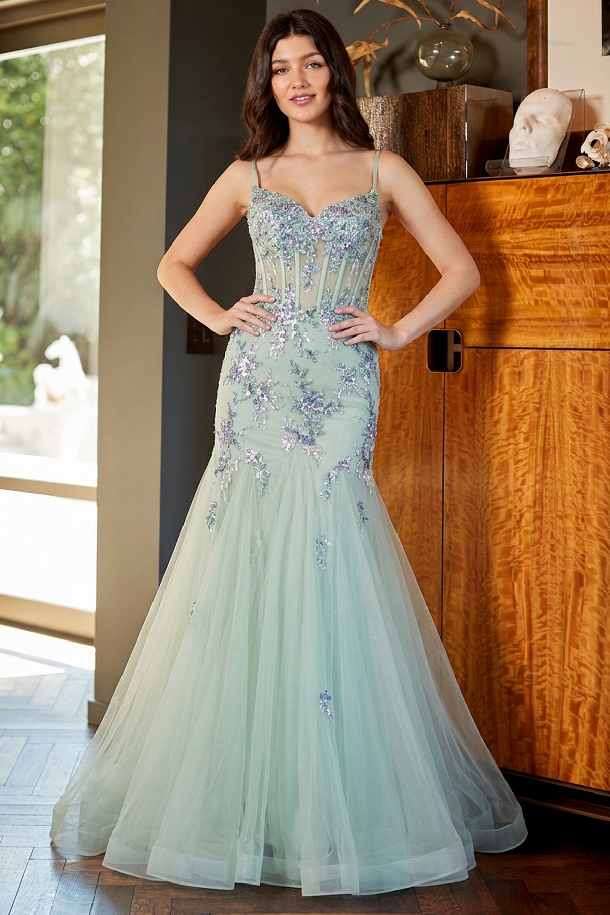 Amelia Couture 2164 sage green floor-length mermaid prom dress with a sweetheart neckline, thin straps, and silver floral embroidery on the bodice and skirt.