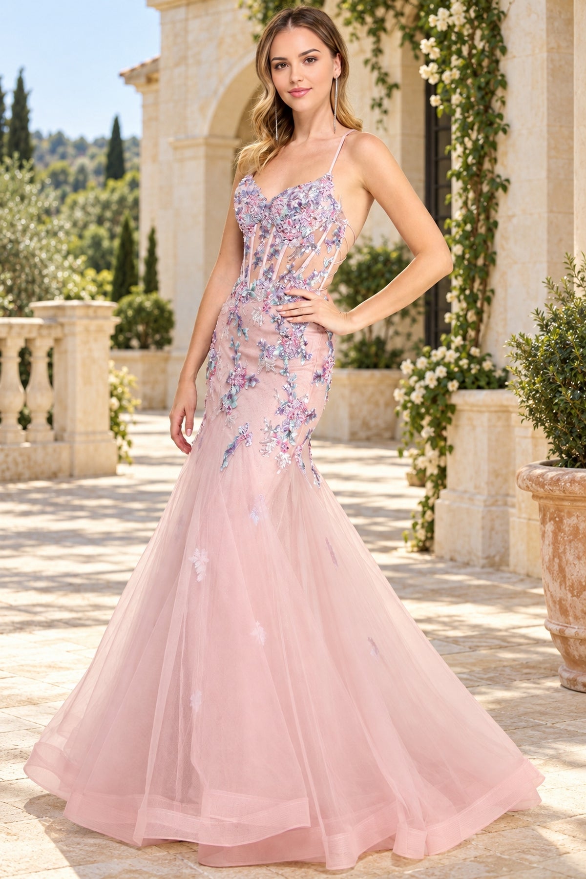 Amelia Couture 2164 is a pink floor-length floral prom dress with a corset-style bodice featuring sequin flower appliques and a flared tulle skirt.