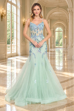 Amelia Couture 2164 floor-length mint green mermaid prom dress with a sheer corset bodice, spaghetti straps, and blue floral embroidery with sequin flower appliques.