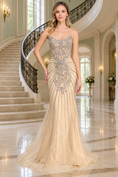 Amelia Couture 2165 floor-length, strapless beige mermaid prom dress featuring silver beaded starburst embellishments across the bodice and skirt.