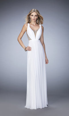 A woman poses against a plain gray background wearing the La Femme 22238, a sleeveless white long prom dress with an open back, A-line silhouette, and sheer panel detailing.