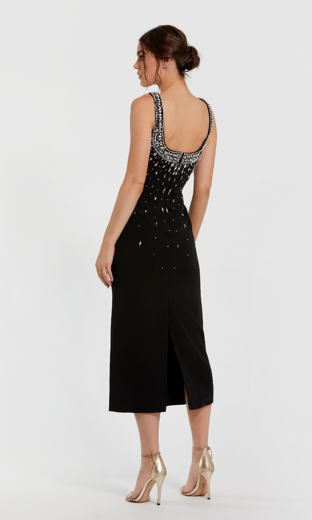 Black dress with beaded details on a white background