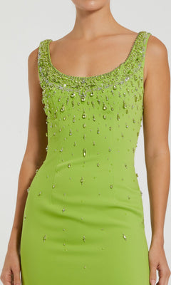A person wearing a sleeveless black Mac Duggal 2259 midi dress, designed for wedding guests.