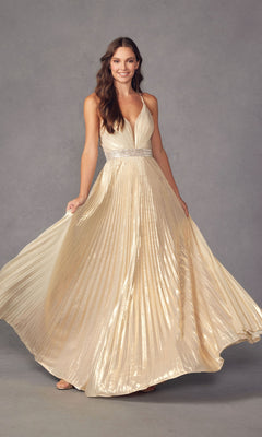 A woman stands against a gray background, holding out the sides of her Deep V-Neck Pleated Long A-Line Prom Dress 226, featuring gold fabric, a deep V-neckline, pleats, and a sparkly rhinestone belt.
