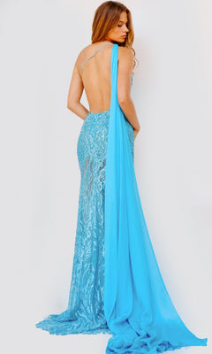 A woman wears the Jovani Shoulder-Drape Sheer Long Prom Dress 22602, a backless, floor-length sequin-print gown with a long blue drape, standing against a plain light background.