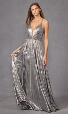 A woman wearing the Deep V-Neck Pleated Long A-Line Prom Dress 226—sleeveless, floor-length, silver metallic with a pleated skirt and rhinestone belt—stands against a plain gray background.