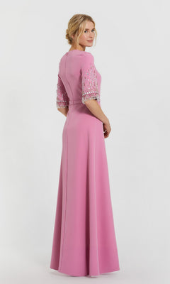 Woman in a Mac Duggal 2270 Short Sleeve Sleek Formal Dress stands turned slightly away against a plain white background.